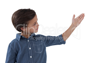 Boy posing against white background