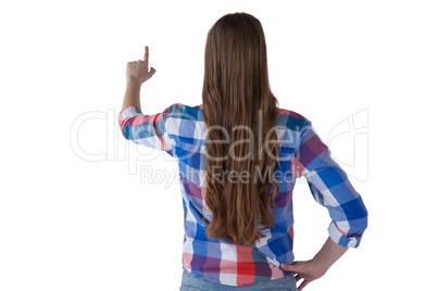 Girl pressing an invisible virtual screen against white background