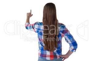 Girl pressing an invisible virtual screen against white background