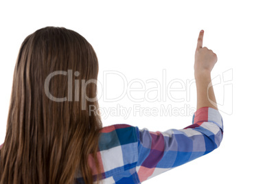 Girl pressing an invisible virtual screen against white background