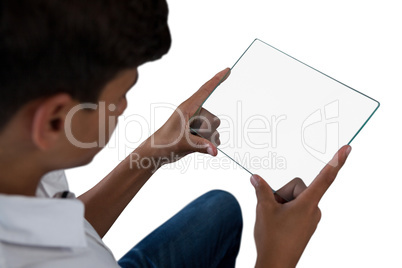 Teenage boy using a glass digital tablet
