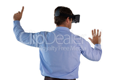Businessman wearing VR glasses pointing