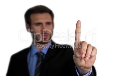 Close up of businessman touching index finger on invisible interface