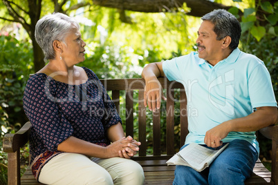 Senior couple arguing while sitting on the bench