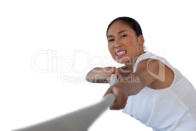 Close up portrait of woman clenching teeth while pulling rope
