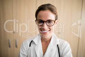 Close-up of smiling female doctor wearing eyeglasses