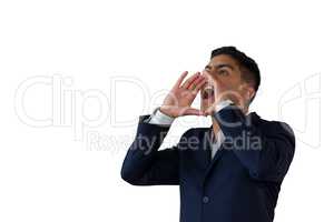 Businessman with hands covering mouth shouting