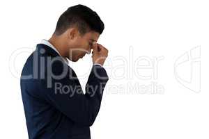 Side view of businessman suffering from headache