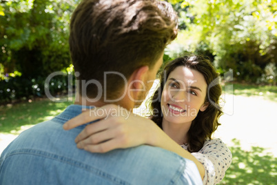 Romantic couple looking face to face in garden