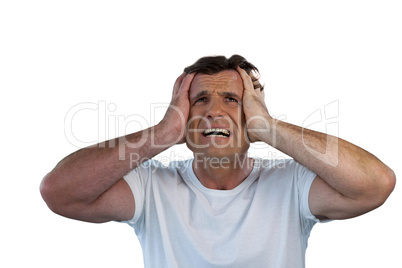 Mature man with head in hand suffering from headache