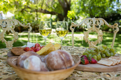 Wine glasses and food on table