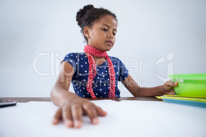 Girl as businesswoman working at desk