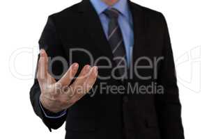 Mid section of businessman in suit gesturing