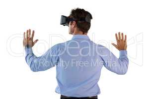 Rear view of man wearing VR glasses