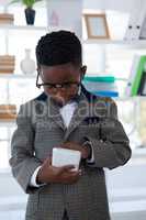 Businessman wearing eyeglasses using smart phone