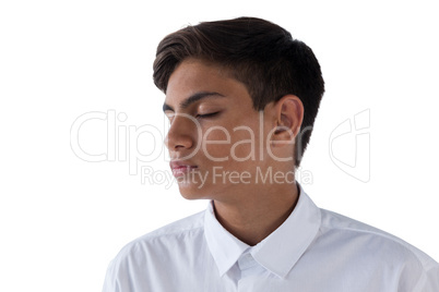 Teenage boy against white background