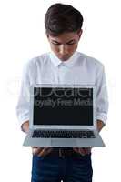 Boy holding laptop