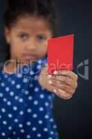 Portrait of girl showing blank red card