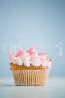 Close-up of pink cupcake on table