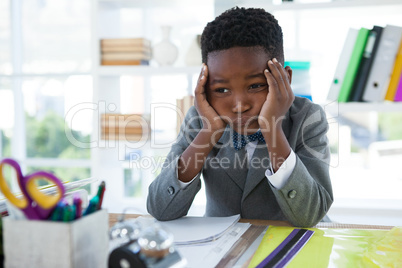 Businessman with hand on chin