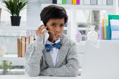 Portrait of businessman talking on mobile phone