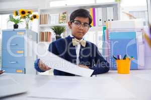 Portrait of businessman holding paper