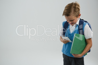 Schoolboy using mobile phone