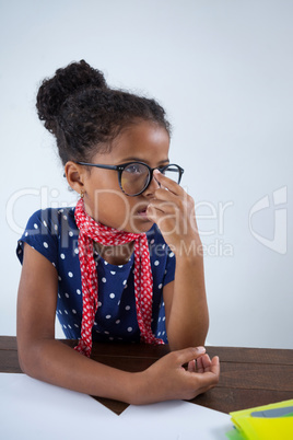 Thoughtful girl imitating as businesswoman