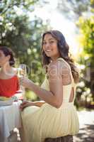 Woman holding a wine glass in restaurant