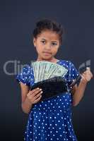 Portrait of girl showing currency in purse