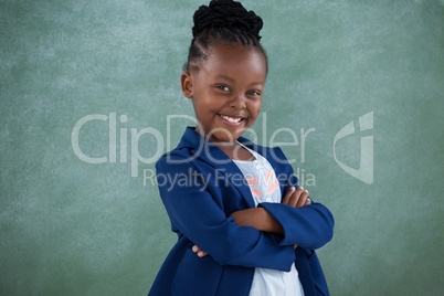 Portrait of happy confident businesswoman with arms crossed