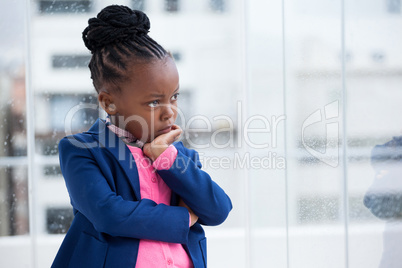 Thoughtful businesswoman with hand on chin