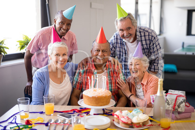 Portrait of cheerful senior people celebrating birthday