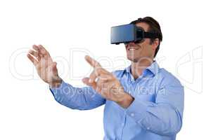 Happy businessman gesturing while wearing virtual reality simulator