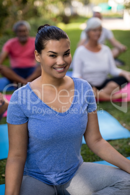 Portrait of smiling trainer with senior people