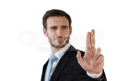 Confident businessman touching interface