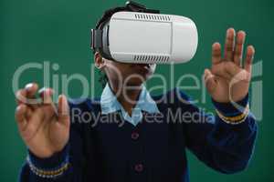 Schoolgirl using virtual reality headset