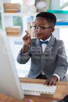Businessman pointing while working at desk