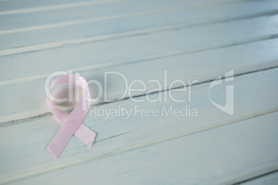 High angle view of pink Breast Cancer Awareness ribbon on table
