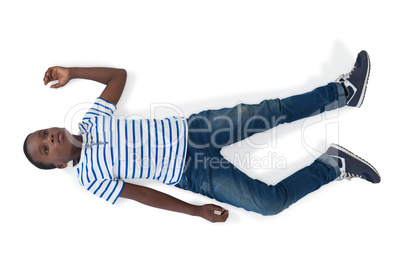 Boy lying on white background