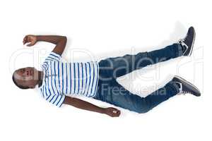 Boy lying on white background