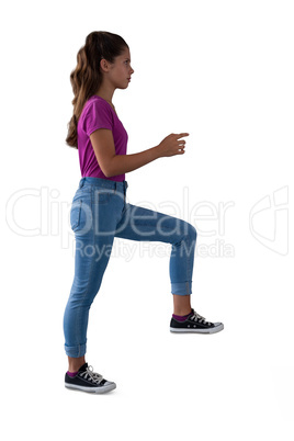 Girl walking on stairs against white background
