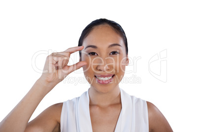 Portrait of happy businesswoman adjusting invisible eyeglasses