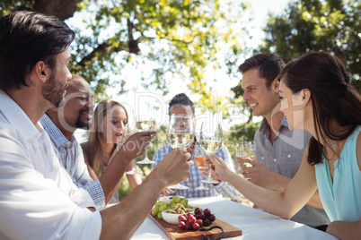 Group of friends toasting champagne glasses