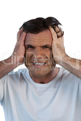 Close up portrait of mature man suffering from headache