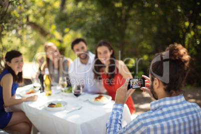 Man clicking photograph of his friends