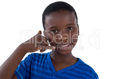 Cute boy pretending to talk on a cell phone