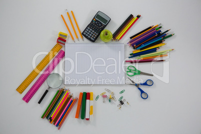 Various school supplies arranged on white background