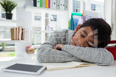 Close up of businessman sleeping on desk