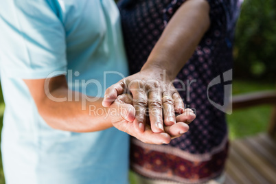 Senior couple dancing in the garden